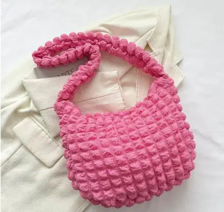 Quilted tote bag worn on shoulder casual outfit