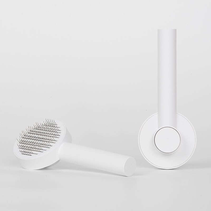 round handle pet comb with sticky bead massage close up