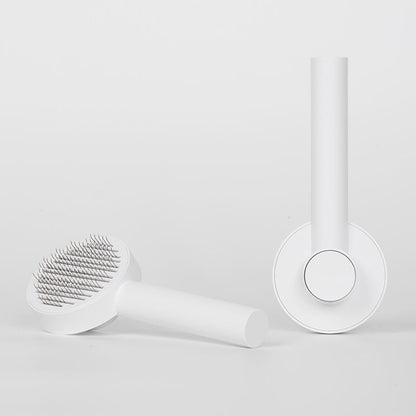 round handle pet comb with sticky bead massage close up